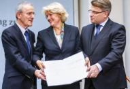 Christoph Schaeublin of the Bern Art Museum, Federal Government Commissioner for Culture Monika Gruetters and Bavaria's Justice Minister Winfried Bausback (L-R) pose after signing a contract on the collection from the late Cornelius Gurlitt in Berlin November 24, 2014. REUTERS/Hannibal Hanschke