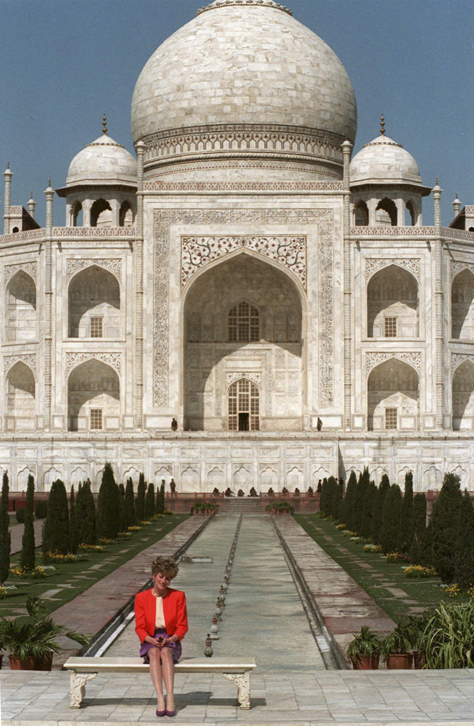 FILE - Princess Diana sits alone in front of the Taj Mahal in Agra, India on Feb. 11, 1992. Above all, there was shock. That’s the word people use over and over again when they remember Princess Diana’s death in a Paris car crash 25 years ago this week. The woman the world watched grow from a shy teenage nursery school teacher into a glamorous celebrity who comforted AIDS patients and campaigned for landmine removal couldn’t be dead at the age of 36, could she? (AP Photo/Udo Weitz, File)