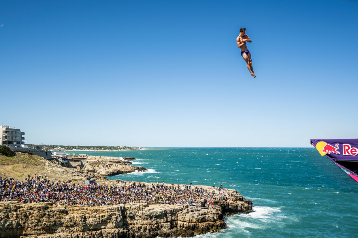 Aidan Heslop dives from the 28 metre platform during the final competition day of the seventh stop of the Red Bull Cliff Diving World Series at Polignano a Mare, Italy. 