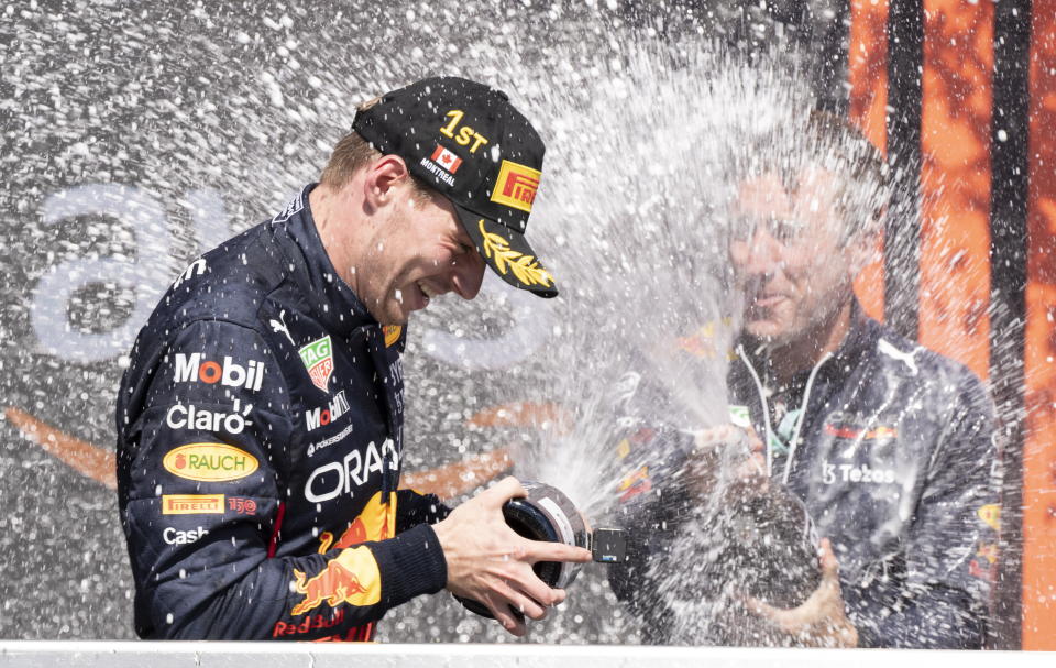 Red Bull Racing Max Verstappen, of the Netherlands, is sprayed with champagne by members of his team after winning the Canadian Grand Prix in Montreal on Sunday, June 19, 2022. (Paul Chiasson/The Canadian Press via AP)