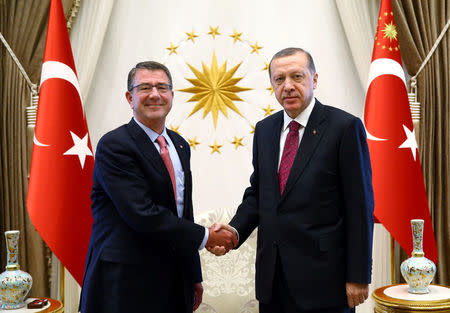 Turkey's President Tayyip Erdogan (R) shakes hands with U.S. Defense Secretary Ash Carter at the Presidential Palace in Ankara, Turkey, October 21, 2016. Kayhan Ozer/Presidential Palace/Handout via REUTERS