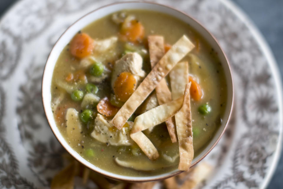 This Dec. 2, 2013 photo shows Chinese chicken and vegetable soup in Concord, N.H. This recipe's fragrant broth is essentially a Chinese version of a Jewish chicken soup. (AP Photo/Matthew Mead)