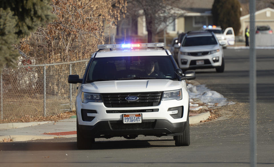 Police comb the neighborhood East of Fashion Place Mall in Murray, Utah, following a shooting on the south east corner of the mall on Sunday, Jan. 13, 2019.(Francisco Kjolseth/The Salt Lake Tribune via AP)