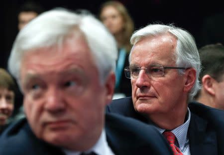 Britain's Secretary of State for Exiting the European Union David Davis (L) and European Union's chief Brexit negotiator Michel Barnier wait in a press room at the EC headquarters in Brussels, Belgium December 8, 2017. REUTERS/Yves Herman - RC1BB38BDC00