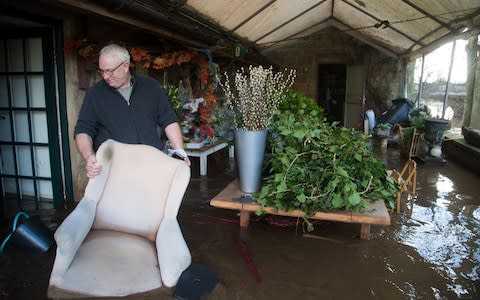 Ian Busting surveys the damage to his home in Milford  - Credit: Rod Kirkpatrick/F Stop Press