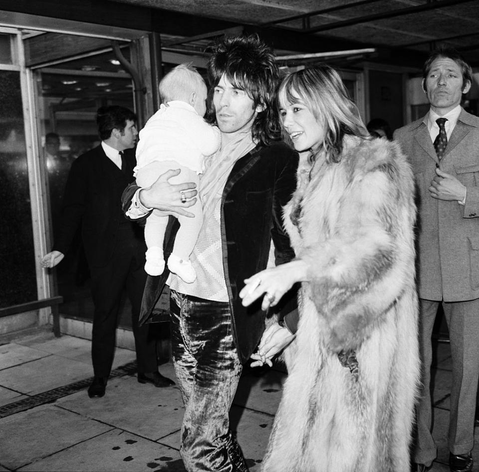 rolling stones guitarist keith richards at heathrow airport met by anita pallenberg and four month old son marlon, decem