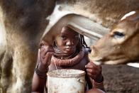 Ohamaremba, Opuwo, Namibia. Purakuatua Tjiposa is living with her family in a small village of 17 people in northern Namibia. Last year they took part in a Swedish reality show without being compensated for not being able to herd their cattle and milk the cows. In the end there was no food for the children. This led to a big debate and a new set of rules for TV teams filming indigenous people. <br><br>Camera: Canon EOS 5D Mark II <br><br>Malin Palm, Sweden <br><br>Special Mention, Cultures & Traditions