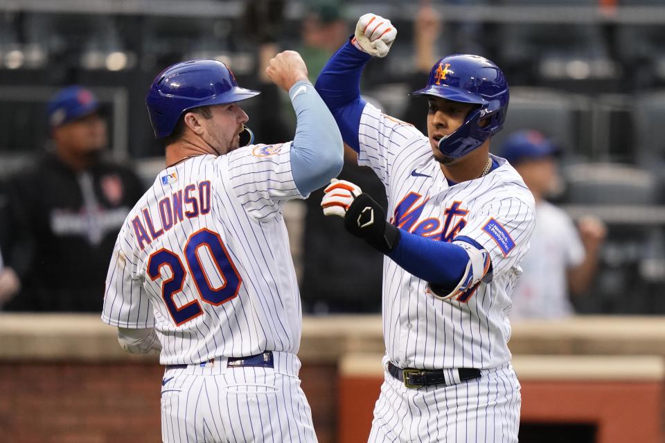 New York Mets' Pete Alonso (20) celebrates with Mark Vientos after Vientos hit a two-run home run during the sixth inning in the first baseball game of a doubleheader against the Miami Marlins, Wednesday, Sept. 27, 2023, in New York. (AP Photo/Frank Franklin II)