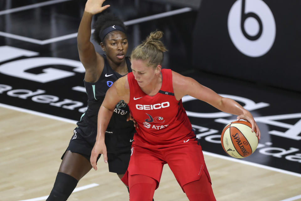 Washington Mystics' Emma Meesseman backs into the defense of New York Liberty's Jocelyn Willoughby during the first half of a WNBA basketball game Saturday, Sept. 12, 2020, in Bradenton, Fla. (AP Photo/Mike Carlson)