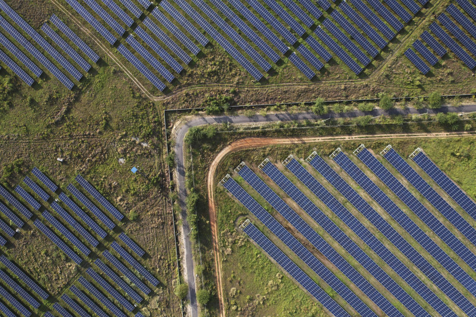 A solar power plant in Pavagada Tumkur district, in the southern Indian state of Karnataka, India, Thursday, Sept. 15, 2022. India is investing heavily in renewable energy and has committed to producing 50% of its power from clean energy sources by 2030. (AP Photo/Rafiq Maqbool)