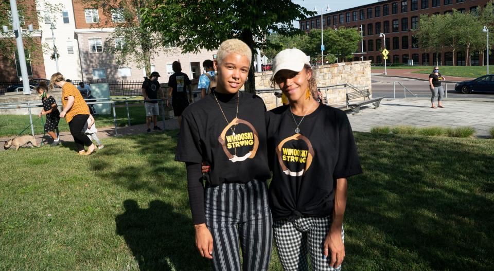 Eliza, left, and Roselie Phillip of Burlington-based creative agency OKAY!!OKAY!! pose with "Winooski Strong" t-shirts. Eliza designed the T-shirt's front logo.