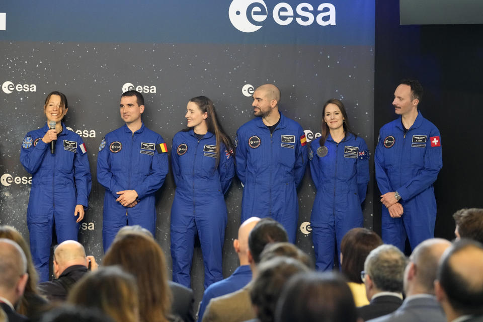 From left, Sophie Adenot of France, Raphael Liegeois of Belgium, Rosemary Cooga of Britain, Pablo Alvarez Fernandez of Spain, Katherine Bennell-Pegg of Australia and Marco Sieber of Switzerland, stand at the graduation ceremony of astronaut candidates of the Class of 2022 at the European Astronaut Centre in Cologne, Germany, Monday, April 22, 2024. The new ESA astronauts took up duty at the European Astronaut Centre one year ago to be trained to the highest level of standards as specified by the International Space Station partners. Also concluding a year of astronaut basic training is Australian astronaut candidate Katherine Bennell-Pegg, who has trained alongside ESA's candidates. (AP Photo/Martin Meissner)