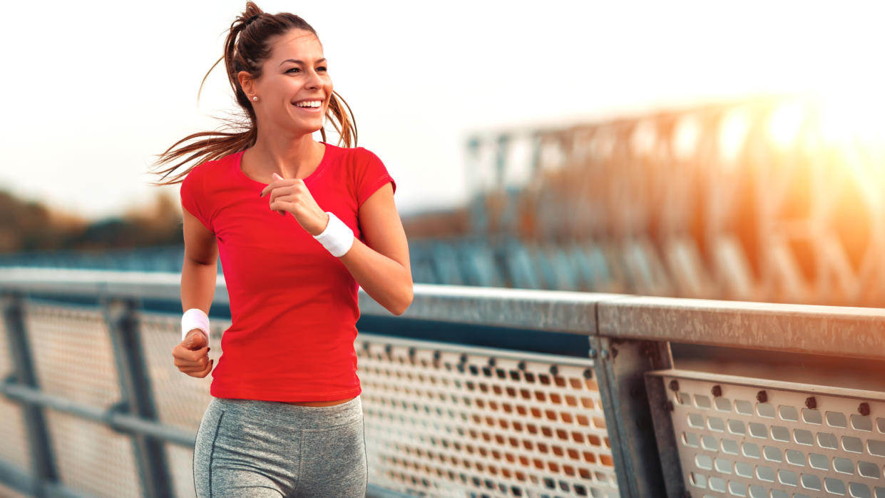  A woman smiling while running. 