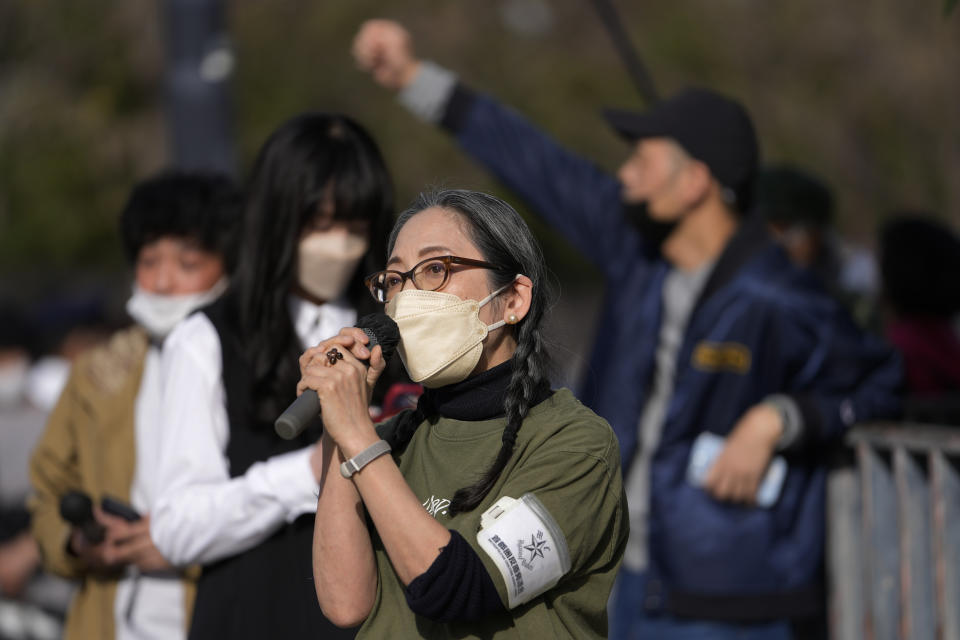 A woman chants slogans during a protest against the government of using the nuclear power, joining others gathered across from the prime minister's official residence in Tokyo, Saturday, March 11, 2023, on the 12th anniversary of a disaster following a devastating earthquake and tsunami in Japan's Tohoku region. (AP Photo/Hiro Komae)