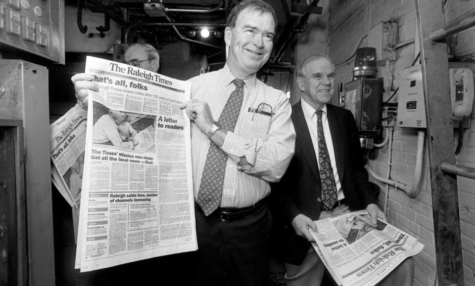 Publisher Frank Daniels Jr. and Raleigh Times Editor A.C. Snow look over the final edition of the Raleigh Times as it rolls off the presses on November 30, 1989 in Raleigh, N.C.