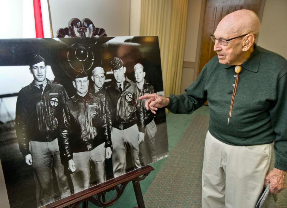 Dick Cole points himself out in a picture of the lead aircraft in the Doolittle Raid on Japan during World War II during a 2014 visit to the Emerald Coast. Then Lt. Richard Cole is pictured second from right, next to Lt. Col. James Doolittle. 