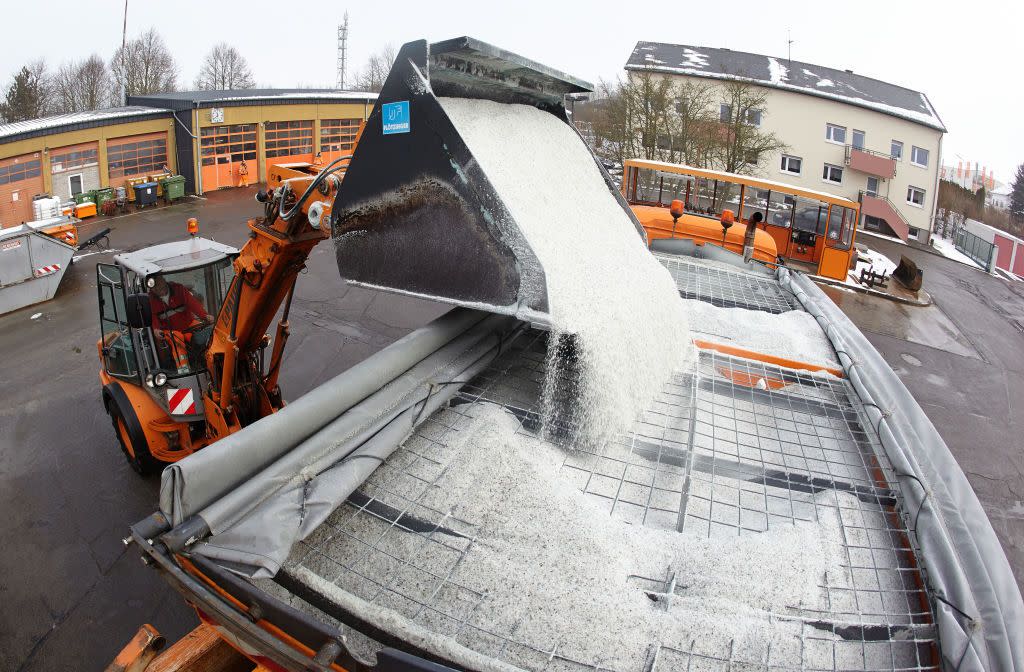 A salt truck is loaded at a road maintenance depot. (Getty Images)