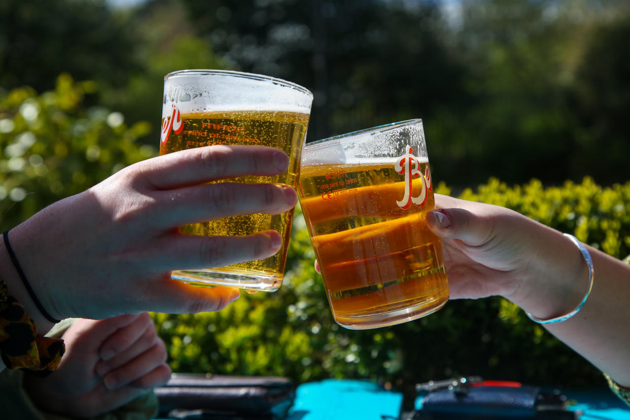 LONDON, UNITED KINGDOM - 2021/04/12: A couple raises their pints of beer on a warm sunny morning in a beer garden of a pub in London.
According to the Met Office, warm weather is forecasted for the next few days in the south east of England. (Photo by Dinendra Haria/SOPA Images/LightRocket via Getty Images)