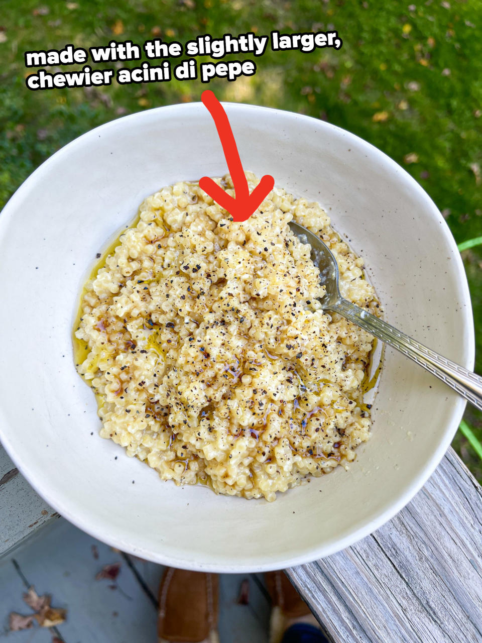 arrow pointing to a bowl of pastina made with larger, chewier acini di pepe pasta