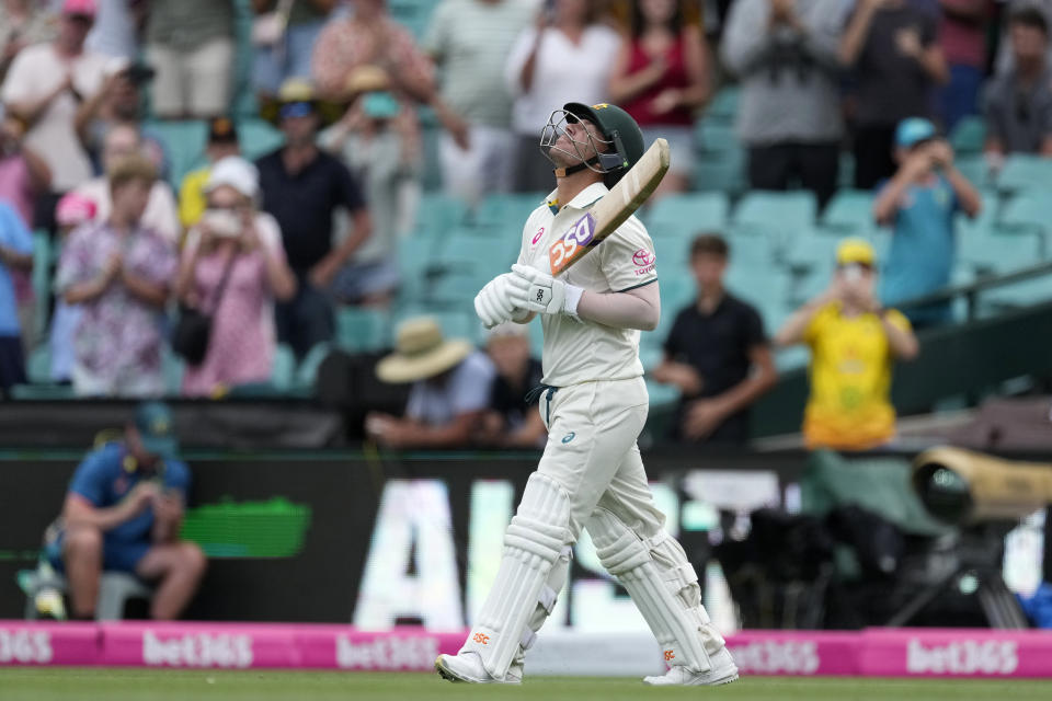 Australia's David Warner walks out to open the batting in Australia's first innings against Pakistan during their cricket test match in Sydney, Wednesday, Jan. 3, 2024. (AP Photo/Rick Rycroft)