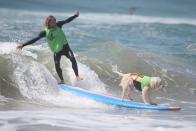 <p>A man surfs with his dog during the Surf City Surf Dog competition in Huntington Beach, California, U.S., September 25, 2016. REUTERS/Lucy Nicholson</p>