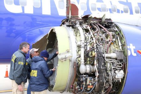 FILE PHOTO: U.S. NTSB investigators are on scene examining damage to the engine of the Southwest Airlines plane in this image released from Philadelphia, Pennsylvania, U.S., April 17, 2018.    NTSB/Handout via REUTERS/File Photo