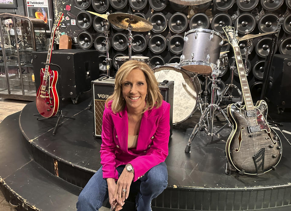 CNN broadcast journalist Alisyn Camerota poses at the former CBGBs nightclub, now a high-end men's clothing outlet, on March 29, 2024 in New York, to promote her memoir "Combat Love: A Story of Leaving, Longing, and Searching for Home." (AP Photo/Dave Bauder)