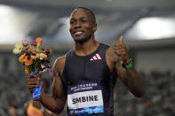 Akani Simbine of South Africa celebrates after winning the gold in the men's 100-meters final during the Diamond League event held in Suzhou in eastern China's Jiangsu province Saturday, April 27, 2024. (AP Photo/Ng Han Guan)