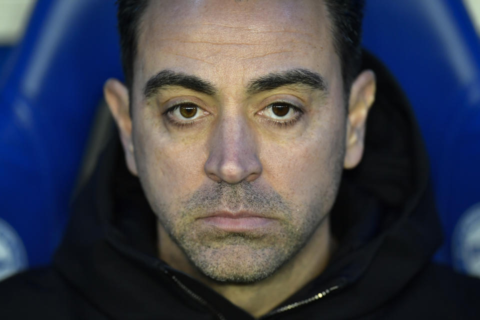 Barcelona's head coach Xavi Hernandez waits for the start of the La Liga soccer match between Deportivo Alaves and FC Barcelona at the Medizorrosa stadium in Vitoria, Spain, Saturday, Feb. 3, 2024. (AP Photo/Alvaro Barrientos)