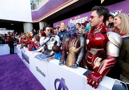 Fans dressed up in costume await the cast members on the red carpet at the world premiere of the film "The Avengers: Endgame" in Los Angeles