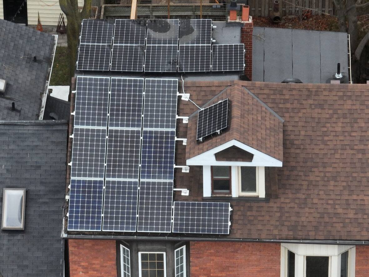 N.B. Power's plan called for a new Moncton subdivision with dozens of homes with roof-top solar panels like this one in Toronto. (Patrick Morrell/CBC - image credit)