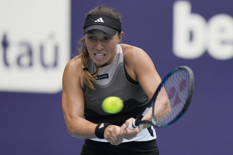 Jessica Pegula returns to Magda Linette of Poland during the Miami Open tennis tournament, Monday, March 27, 2023, in Miami Gardens, Fla. (AP Photo/Marta Lavandier)