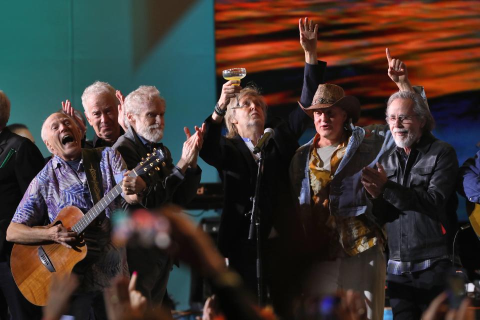 Paul McCartney (center) holds up his margarita to Jimmy Buffett during "Keep the Party Going: A Tribute Concert to Jimmy Buffett" at Los Angeles' Hollywood Bowl.