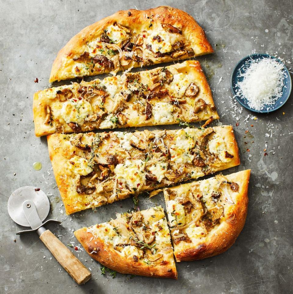 <p>Make the most of a seasonal medley of mushrooms to give this vegetarian appetizer a hearty bite.</p><p>Get the <a href="https://www.goodhousekeeping.com/food-recipes/a38413694/fall-mushroom-pizza-recipe/" rel="nofollow noopener" target="_blank" data-ylk="slk:Fall Mushroom Pizza recipe;elm:context_link;itc:0;sec:content-canvas" class="link "><strong>Fall Mushroom Pizza recipe</strong></a>.</p>