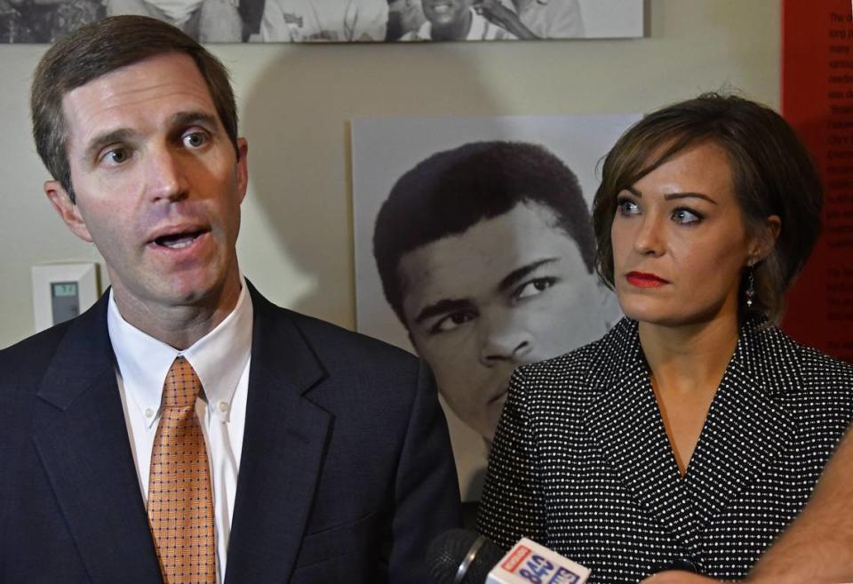 Kentucky Attorney General and democratic gubernatorial candidate Andy Beshear, left, answers a reporter’s question as his running mate, lieutenant gubernatorial candidate Jacqueline Coleman, looks on following their announcement at the Kentucky Center for African American Heritage in Louisville, Ky, Monday, July 9, 2018.
