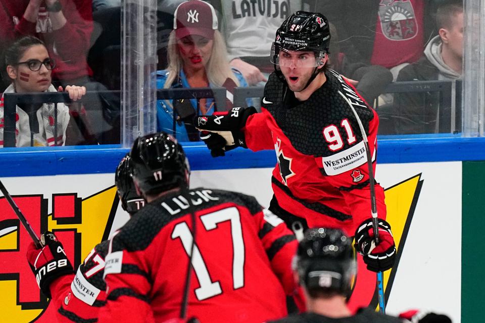 Canada's Adam Fantilli (91) celebrates his goal during their semifinal match against Latvia at the Ice Hockey World Championship in Tampere, Finland, Saturday, May 27, 2023. (AP Photo/Pavel Golovkin)