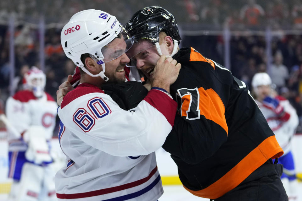 Montreal Canadiens' Alex Belzile, left, and Philadelphia Flyers' Wade Allison fight during the second period of an NHL hockey game, Friday, Feb. 24, 2023, in Philadelphia. (AP Photo/Matt Slocum)