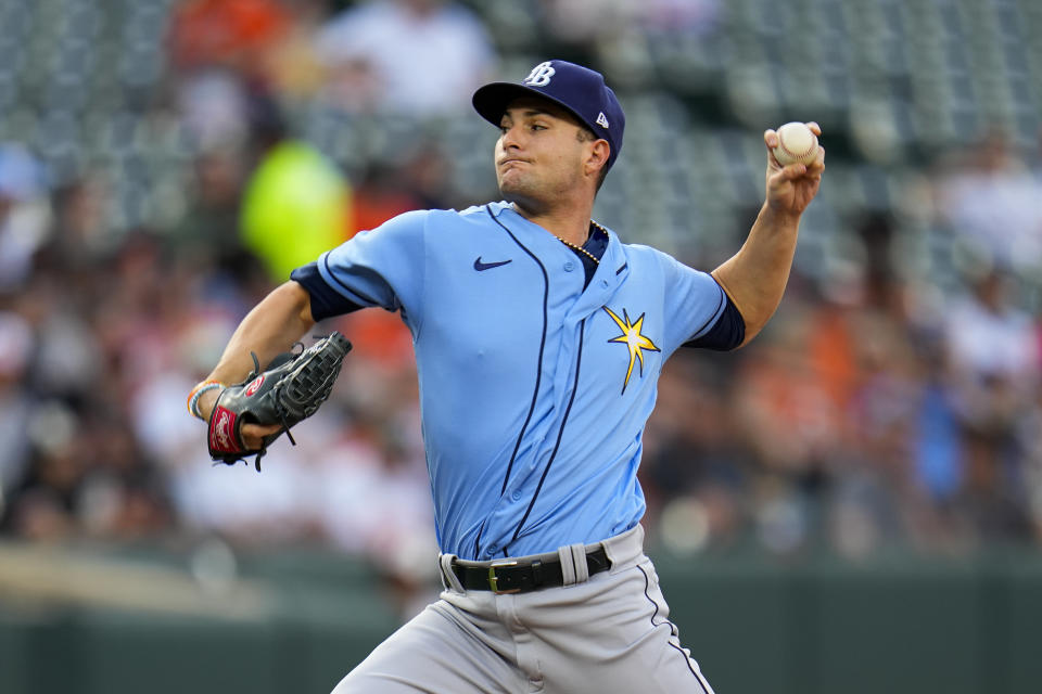 Tampa Bay Rays starting pitcher Shane McClanahan throws a pitch to the Baltimore Orioles during the first inning of a baseball game, Monday, May 8, 2023, in Baltimore. (AP Photo/Julio Cortez)