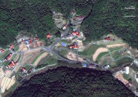A satellite image of "before the floods" south of Enshoji, Japan, captured October 26, 2017. Satellite image 2018 DigitalGlobe, a Maxar company/Handout via REUTERS