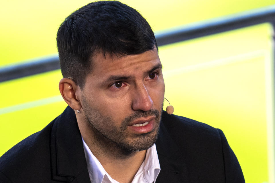 Barcelona striker Sergio Aguero cries during a press conference at the Camp Nou stadium in Barcelona, Spain, Wednesday, Dec. 15, 2021. Sergio Aguero has announced his retirement from football on Wednesday due to a heart condition. (AP Photo/Emilio Morenatti)