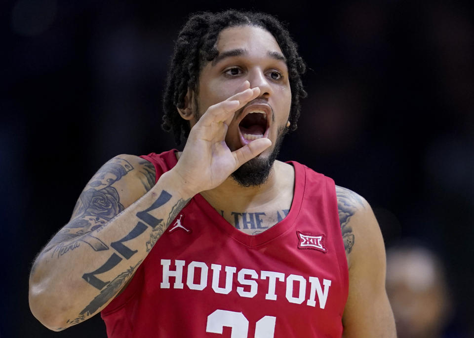 Houston's Emanuel Sharp shouts during the first half of the team's NCAA college basketball game against Xavier, Friday, Dec. 1, 2023, in Cincinnati. (AP Photo/Jeff Dean)
