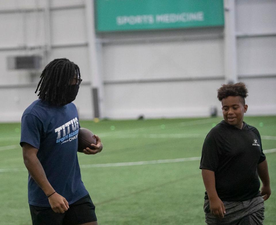 Darnell Savage of the Green Bay Packers has a one-on-one conversation at a free NFL clinic for youths at Chase Fieldhouse in Wilmington on Friday, June 17, 2022.