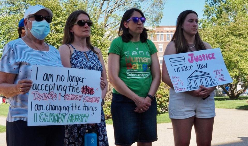 Lois Mattson, Jennifer Burzycki, Jill Smart, and Abby Smart attend an abortion rights rally at the State House on May 13, 2022.