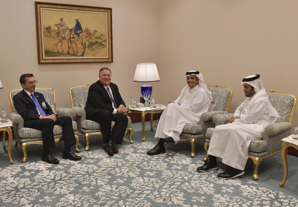 U.S. Secretary of State Mike Pompeo, second left, meets with Qatar's Foreign Minister Sheikh Mohammed bin Abdulrahman Al Thani, third left, before a peace signing ceremony between the U.S. and the Taliban in Doha on Saturday, Feb. 29, 2020. The U.S. is poised to sign a peace agreement with Taliban militants on Saturday aimed at bringing an end to 18 years of bloodshed in Afghanistan and allowing U.S. troops to return home from America's longest war. (Giuseppe Cacace/Pool photo via AP)