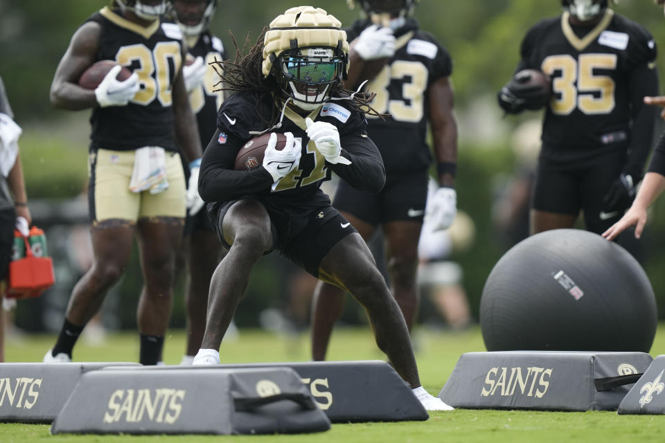 New Orleans Saints running back Alvin Kamara (41) runs through drills at the team's NFL football minicamp in Metairie, La., Thursday, June 15, 2023. (AP Photo/Gerald Herbert)