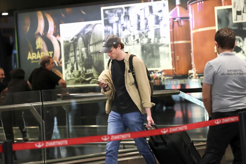 FILE A Russian man arrivals at the International airport Zvartnots outside Yerevan, Armenia, Thursday, Sept. 22, 2022. A day after President Vladimir Putin ordered a partial mobilization to bolster his troops in Ukraine, many Russians are leaving their homes. (Hayk Baghdasaryan/Photolure via AP, File)