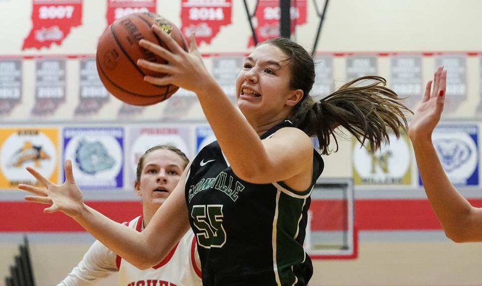 Zionsville Eagles forward Brooke Karesh (55) recovers a rebound Tuesday, Nov. 21, 2023, during the game at Fishers High School in Fishers. The Fishers Tigers defeated the Zionsville Eagles, 46-38.