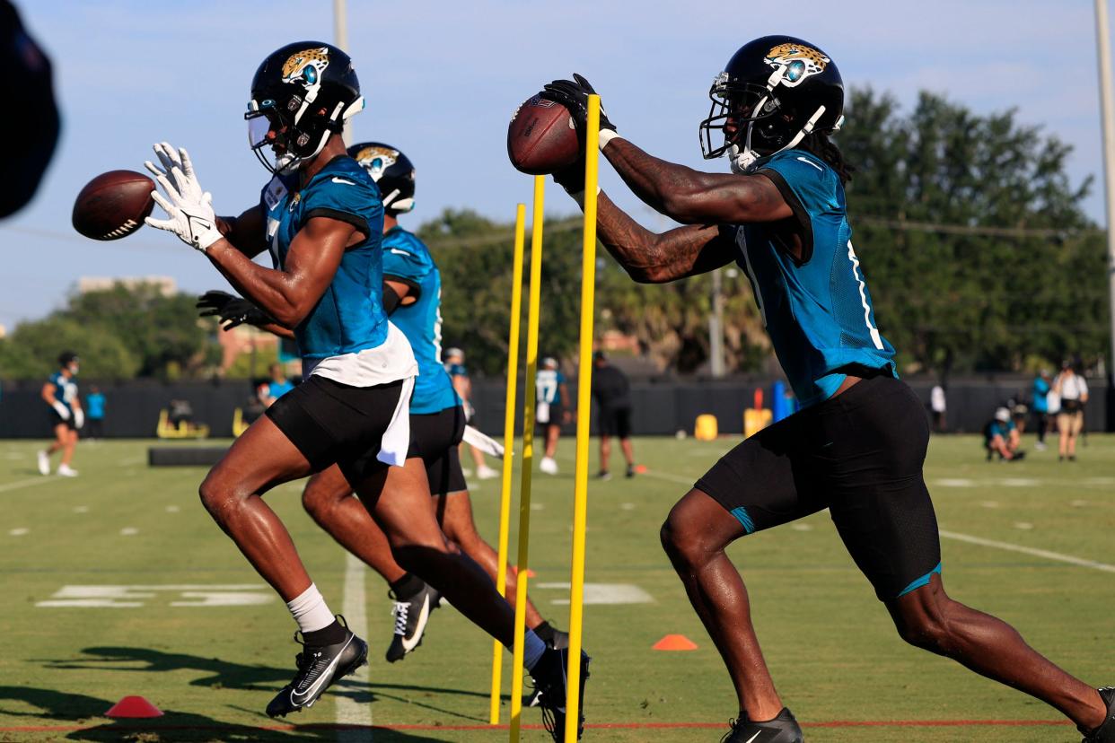 Jacksonville Jaguars wide receiver Zay Jones (7), left, catches a pass next to wide receiver Calvin Ridley (0) Wednesday, July 26, 2023 at Miller Electric Center at EverBank Stadium in Jacksonville, Fla. Today marked the first day of training camp for the Jacksonville Jaguars. 