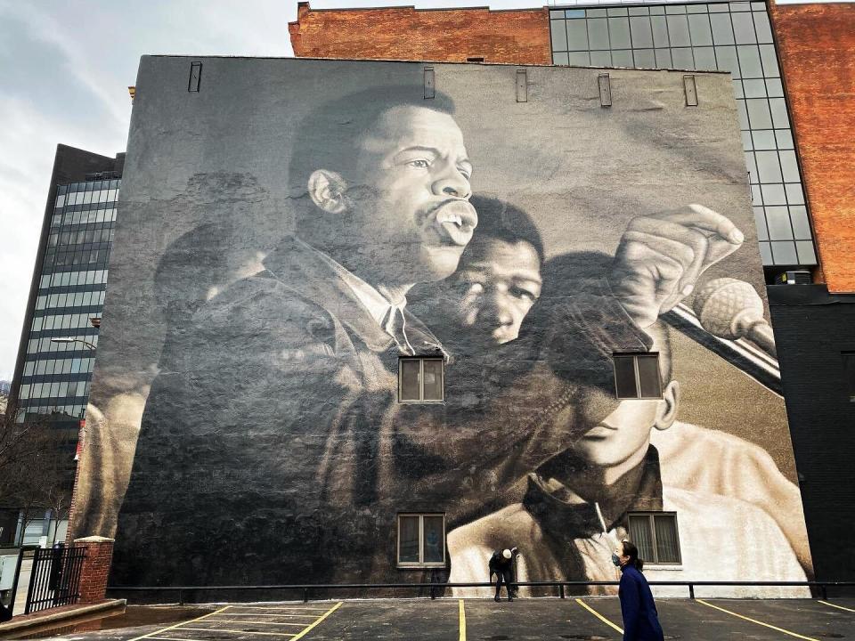 Original photograph of John Lewis by Danny Lyon, taken at the Great March on Washington 1963. Hand-painted mural in Louisville, KY on the NIA center located at 2900 W Broadway.