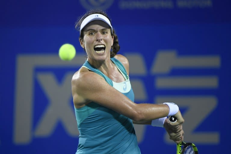 Johanna Konta of Great Britain hits a return against Ashleigh Barty of Australia during their first round women's match at the WTA Wuhan Open tennis tournament in Wuhan, in China's central Hubei province on September 25, 2017